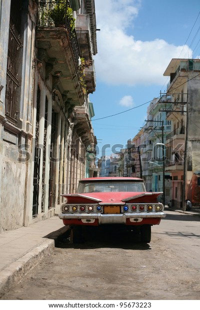 HAVANA - 27 MARCH: Vintage car in Cuba, Havana,\
March 27, 2007. October 2011, Cuban people finally got the right to\
trade on buying and selling cars. Ban on trade with cars was\
introduced in 1959.