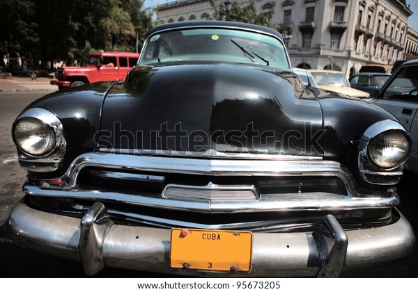 HAVANA - 30 MARCH: Vintage car in Cuba, Havana,\
March 30, 2007. October 2011, Cuban people finally got the right to\
trade on buying and selling cars. Ban on trade with cars was\
introduced in 1959.