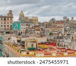 Havana from the above. View over the rooftops of Havana in Cuba with the Capitol. Rooftops of Old Havana, Cuba on a cloudy day. View of rooftops of old houses