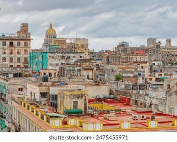 Havana from the above. View over the rooftops of Havana in Cuba with the Capitol. Rooftops of Old Havana, Cuba on a cloudy day. View of rooftops of old houses - Powered by Shutterstock