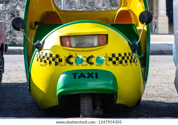 Havana, Cuba - 11/21/2018: Vehicle\
(taxi) typical from Cuba, known as Coco táxi or Côco\
Móvil