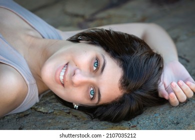 Havana, Cuba. April 17, 2019. Close Up Portrait Of Young Woman Lying On Floor