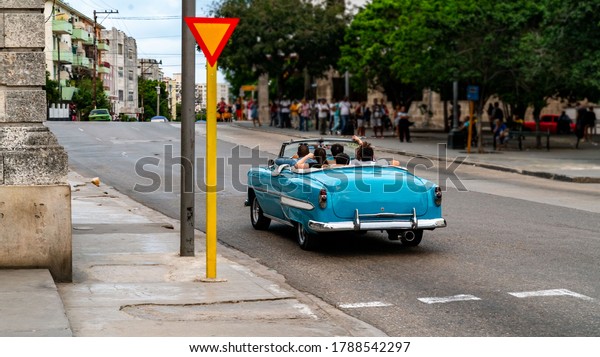 Havana, Cuba.\
Cars on the vibrant city`s\
streets.