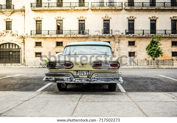 HAVANA, CUBA, CIRCA APRIL 2017: Yellow american\
classic car parked in Havana, Cuba. city, Cuba has over 60.000\
classic cars.\
