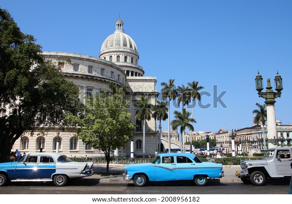 HAVANA, CUBA - FEBRUARY 26, 2011: Oldtimer cars\
parked in Havana, Cuba. Cuba has one of the lowest car-per-capita\
rates (38 per 1000 people in\
2008).