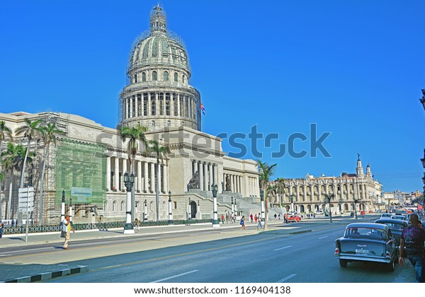 HAVANA, CUBA - FEBRUARY 26, 2018\
- Paseo de Marti (Paseo del Prado) boulevard in the centre of\
Havana, with the El Capitolio, the symbol of Cuban\
capital