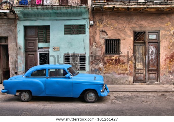 HAVANA, CUBA - FEBRUARY 27,\
2011: Vintage oldtimer car parked in the street of Havana, Cuba.\
Cuba has one of the lowest car-per-capita rates (38 per 1000 people\
in 2008).