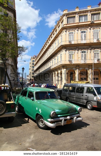 HAVANA, CUBA - FEBRUARY 27, 2011: People drive in\
Havana, Cuba. Cuba has one of the lowest car-per-capita rates (38\
per 1000 people in\
2008).
