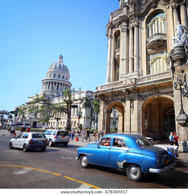 HAVANA, CUBA - FEBRUARY 27, 2011: Classic American\
cars in Havana. Cuba has one of the lowest car-per-capita rates (38\
per 1000 people in\
2008).