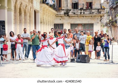 HAVANA, CUBA - JANUARY 1, 2013 Local Kids In Traditional Outfits Perform Dancing And Singing On Street In Old Havana, Cuba.