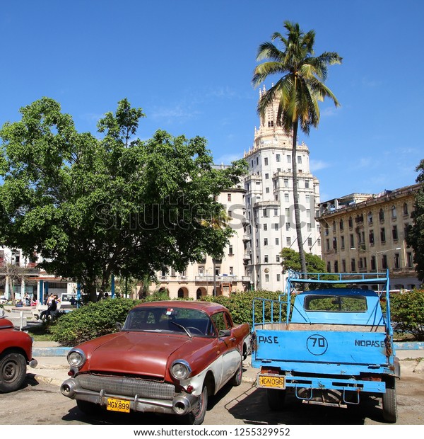 HAVANA, CUBA - JANUARY 30, 2011: Classic American\
cars in Havana. Cuba has one of the lowest car-per-capita rates (38\
per 1000 people in\
2008).