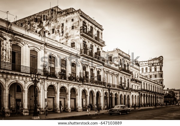 HAVANA, CUBA - JULY 05, 2015: HDR -\
Architecture with street life view in Havana City Cuba - Retro\
Serie SEPIA Cuba\
Reportage
