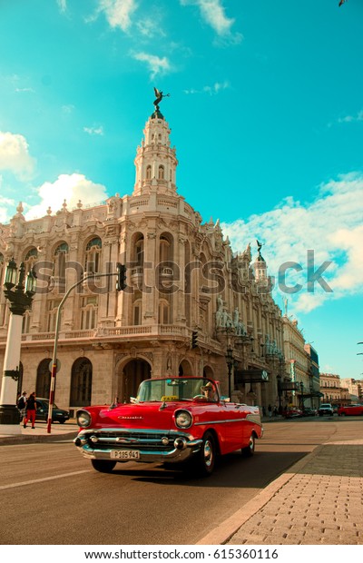 Havana, Cuba - March 2017: An\
Oldtimer in front of the Gran Teatro de la Habana, Havana, Cuba\
