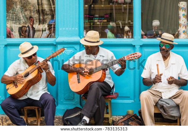 Havana, Cuba -\
March 24, 2017: Elderly street musicians playing traditional cuban\
music on the street in old\
Havana