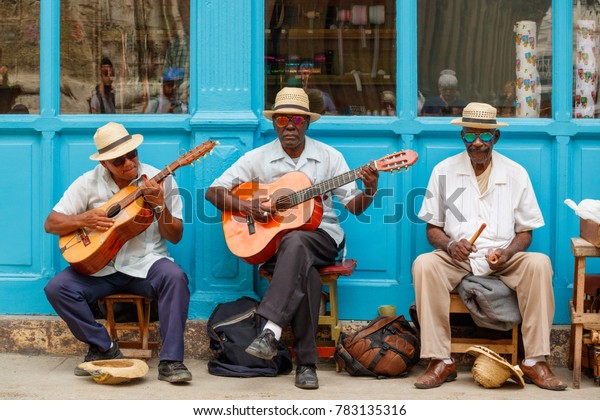Havana, Cuba -\
March 24, 2017: Elderly street musicians playing traditional cuban\
music on the street in old\
Havana