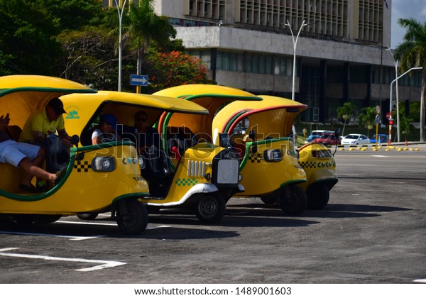 Havana, Cuba May 16,2019 Coco\
taxis are motorized rickshaws type vehicles used in Cuba. Most are\
yellow and round like a coconut. These are mainly used for\
tourist.