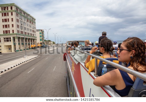 Havana, Cuba - May 23, 2019: View from
a Touristic Bus Tour, Hop on Hop Off, in the streets of the Old
Havana City during a vibrant and bright sunny
day.