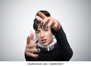 Havana, Cuba. May 23, 2022. Young Woman Wearing Ruff With Hands Forward Against White Background