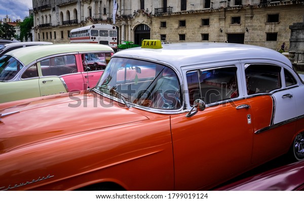 Havana, Cuba - November 27, 2013:\
Beautiful old taxi cabs seen parked along the street of\
Havana.