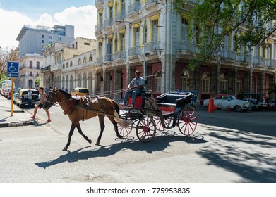 HAVANA, CUBA - OCTOBER 20, 2017: Colorful Havana Old Town Architecture And Horse Rider On The Street