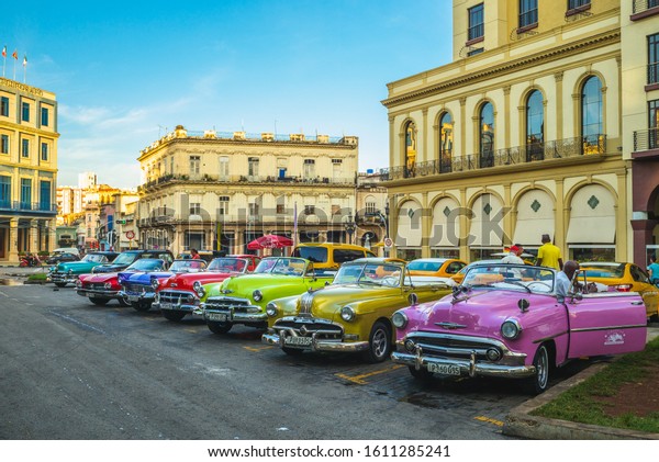 Havana, Cuba - October 28,\
2019: colorful vintage classic cars in havana, an iconic part of\
the culture 