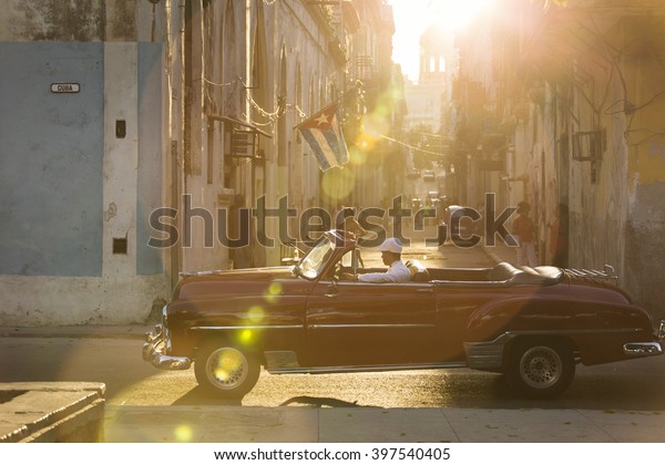 HAVANA, CUBA-OCTOBER 25:Colourful cars streets\
of Havana in October 25, 2015 in Havana. With 2.4 mil. inhabitants\
in the city and 3.7 in its urban area,Havana is the largest city in\
the Caribbean