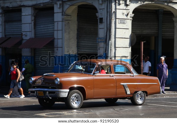 HAVANA - FEBRUARY 24: Classic American Mercury car\
on February 24, 2011 in Havana. Recent law change allows Cubans to\
trade cars again. Old law resulted in very old fleet of private\
owned cars in Cuba