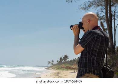 Havana, La Habana Province, Cuba - April 5, 2016: Caucasian Male Tourist Taking A Photo Of The Ocean.