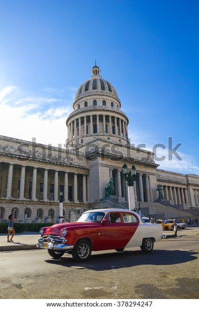 HAVANA, SEP 7: A\
vintage car circulating in front of the Capitol on September 23,\
2011 in Havana, Cuba. Cubans, unable to buy newer models, keep\
thousands of them\
running.