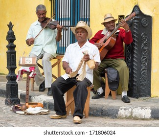 HAVANA,CUBA - JANUARY 15, 2014:Afrocuban Street Musicians Playing Traditional Music.2 850 000 Foreign Tourists Visited Cuba In 2013,many Of Them Attracted By Its Distinct Culture