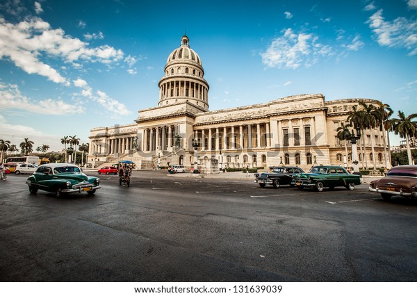 HAVANA-JUNE 7:\
Old car rides in front of the Capitol on June 7, 2011 in Havana.\
Before a new law issued on October 2011, cubans could only trade\
cars that were on the road before\
1959.