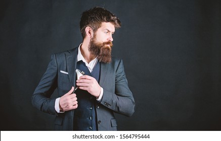 Have alcohol drink with you. Always with me. Flat metal bottle for alcohol. Man bearded hipster wear elegant suit hold metal flask for alcohol. Guy hide metal flask into pocket. Alcohol drink concept. - Powered by Shutterstock