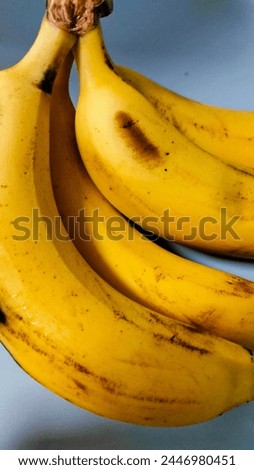 have Four beautiful bananas with peel 