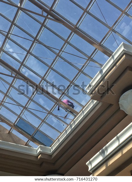 Have Guy Clean On Glass Roof Stock Photo Edit Now 716431270