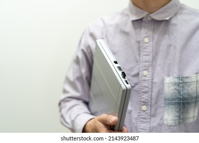 
I Have A Laptop In A Light Purple Shirt.Start Walking With Your Laptop