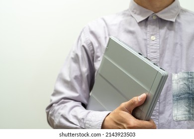 
I Have A Laptop In A Light Purple Shirt.Start Walking With Your Laptop