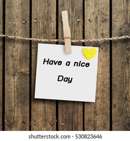 Have a nice day of paper with wood clip on wood background design. - Shutterstock ID 530823646