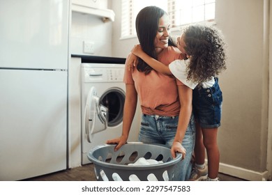 Have I told you I love you today. an adorable young girl hugging her mother while helping her with the laundry at home. - Powered by Shutterstock