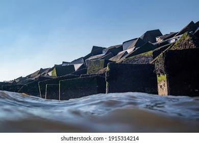 Havenhoofd protection wall in Scheveningen harbour water view