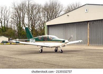 Haverfordwest, Wales - March 2022: French Registered Socata Trinidad Single Engined Private Plane Taxiing From The Hanger Area For Take Off. 