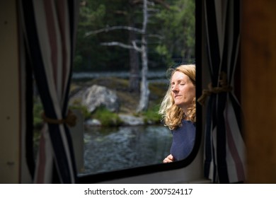 Haverud, Sweden July 2, 2021 A Woman Passenger On A Canal Boat Along The Dalsland Canal In Western Central Sweden.