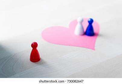 Having Affair, Infidelity Or Cheating Concept. Love Triangle Or Being Third Wheel. Board Game Pawns And Paper Heart On Table. 