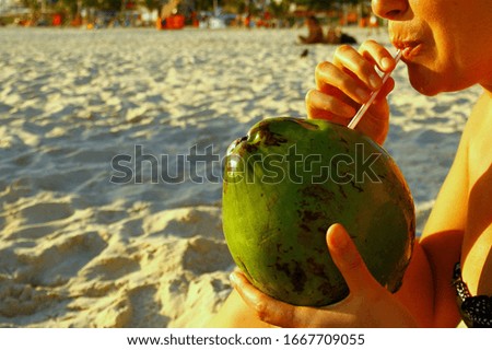 Having coconut milk on Ipanema Beach, Rio de Janeiro, Brazil.