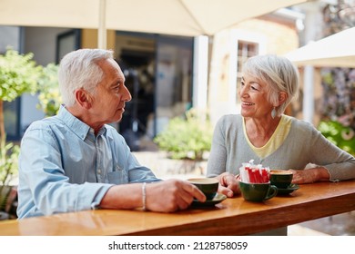 Having Coffee After Meeting At An Online Dating Site. Shot Of A Senior Couple Having Coffee At A Cafe.