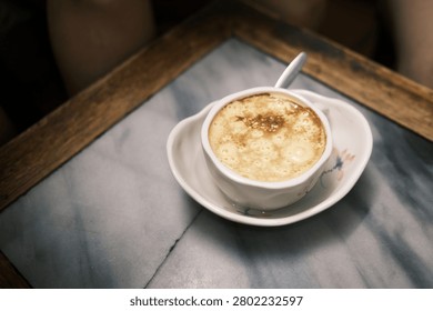 Having a cup of egg coffee during my trip in Vietnam.