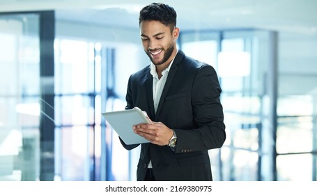 Having a digital tablet makes life more convenient. Shot of a young businessman using a digital tablet. - Shutterstock ID 2169380975