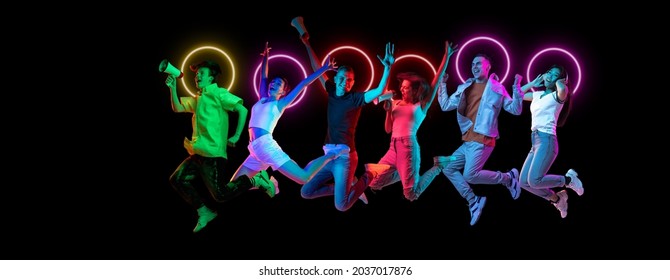 Having fun. Collage made of multiethnic young people jumping together isolated on dark background in multicolored neon light with luminescent shape cirlce. Unity, diversity, youth, ad. Black friday