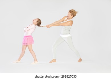 Having Fun / Mother Pulling Her Daughters Fishtail Braid