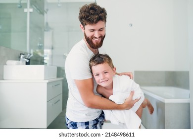 Having a little fun drying off. Cropped shot of a young handsome father drying his adorable little son after a bath in the bathroom at home. - Powered by Shutterstock