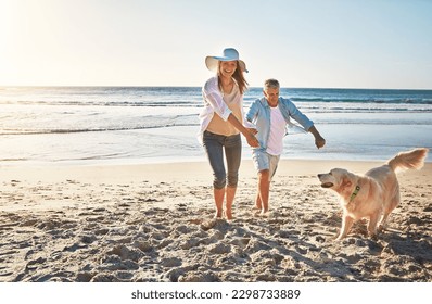 Having so much fun in the sun. a mature couple spending the day at the beach with their dog. - Powered by Shutterstock